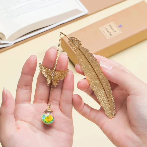 Metal feather bookmark with butterfly charms